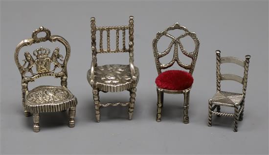 Four miniature white metal chairs including Dutch, largest 62mm.